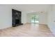 Spacious living room with fireplace, wood floor, sliding glass door and neutral color scheme at 200 Kimrod Ln, Charlotte, NC 28270