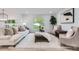 Bright living room with plush white rug, neutral furniture, and a large window offering a view of the outdoors at 200 Kimrod Ln, Charlotte, NC 28270