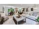 Open floor plan view showcasing living room, dining area, and kitchen with modern finishes and ample natural light at 200 Kimrod Ln, Charlotte, NC 28270