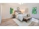 Bright main bedroom with a neutral color palette, wood floors, and comfortable seating area at 200 Kimrod Ln, Charlotte, NC 28270