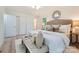 Light and bright main bedroom with a window view and decorative pillows at 200 Kimrod Ln, Charlotte, NC 28270