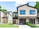 Charming two-story house features modern design, stone accents, and a well-manicured lawn at 2015 Wilson Ave, Charlotte, NC 28208