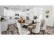 Well-lit dining area next to modern kitchen with granite counters and stainless appliances at 2123 Gemway Dr, Charlotte, NC 28216