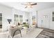 Bright living room with large windows, neutral tones, plush seating, and modern finishes at 2123 Gemway Dr, Charlotte, NC 28216