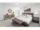 Bright and airy main bedroom with large windows, a comfortable bed, stylish decor and wood-look floors at 2123 Gemway Dr, Charlotte, NC 28216
