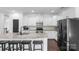 The stylish kitchen island is perfect for entertaining in this modern kitchen space at 2214 Laurens Dr, Concord, NC 28027