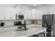 Well-equipped kitchen featuring granite countertops, stainless steel appliances, and a kitchen island at 2214 Laurens Dr, Concord, NC 28027