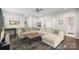 Spacious living room with a large sectional, and a decorative rug at 2214 Laurens Dr, Concord, NC 28027