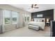 Serene main bedroom with soft lighting, neutral colors, and ample natural light at 2214 Laurens Dr, Concord, NC 28027