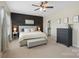 Spacious main bedroom featuring neutral colors, soft lighting, and ensuite access at 2214 Laurens Dr, Concord, NC 28027