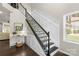 Elegant staircase with iron railings, and beautiful wainscoting at 2214 Laurens Dr, Concord, NC 28027