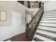 Elegant staircase with iron railings, and beautiful wainscoting at 2214 Laurens Dr, Concord, NC 28027
