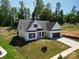 New construction home boasts a pristine lawn and a modern, neutral color palette at 2567 Cornelius Nw Pl, Concord, NC 28027