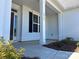 Charming front porch with classic white columns leading to the front door at 2567 Cornelius Nw Pl, Concord, NC 28027