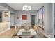 Dining area with a glass table, modern lighting and an open layout at 315 Arlington Ave # 1104, Charlotte, NC 28203