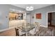 Dining room featuring wood cabinets, glass table and seating with an open floorplan at 315 Arlington Ave # 1104, Charlotte, NC 28203