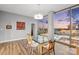 Dining room features a glass table, modern chandelier and expansive city views at 315 Arlington Ave # 1104, Charlotte, NC 28203