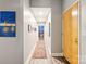 Hallway with wood flooring, artwork, and natural light at 315 Arlington Ave # 1104, Charlotte, NC 28203