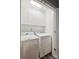 Convenient laundry room with washer and dryer, and ample storage cabinets at 315 Arlington Ave # 1104, Charlotte, NC 28203