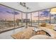 Living room with city views from large windows, neutral furnishings, and ceiling fans at 315 Arlington Ave # 1104, Charlotte, NC 28203