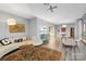 Open-concept living area with sleek floors, unique coffee table, comfortable seating and city views at 315 Arlington Ave # 1104, Charlotte, NC 28203