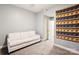 Cozy living room with neutral paint, carpeted floors, and white sofa at 315 Arlington Ave # 1104, Charlotte, NC 28203