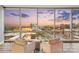 Bright living room featuring large windows with city views and comfortable seating at 315 Arlington Ave # 1104, Charlotte, NC 28203