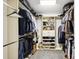 This walk-in closet has built in shelving and hanging space for all your wardrobe storage needs at 315 Arlington Ave # 1104, Charlotte, NC 28203