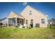 Well-maintained backyard with a screened porch, patio, grill, and manicured lawn, perfect for outdoor entertaining at 3619 Whitney Way, Terrell, NC 28682