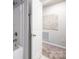 Clean bathroom showcasing a shower and a white door with decorative wall art at 3619 Whitney Way, Terrell, NC 28682