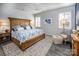 Beautiful bedroom with a large carved wood bed frame, patterned rug, and light gray walls at 3619 Whitney Way, Terrell, NC 28682