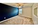 Bright bedroom featuring a ceiling fan, neutral walls, wood-look floors and a blue accent wall at 3619 Whitney Way, Terrell, NC 28682
