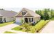 Charming single-Gathering home featuring a well-manicured lawn, attached garage, and a welcoming front porch at 3619 Whitney Way, Terrell, NC 28682