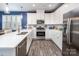 Stylish kitchen featuring stainless steel appliances, quartz countertops, and ample cabinet space for storage at 3619 Whitney Way, Terrell, NC 28682