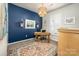 Cozy home office featuring natural light, stylish lighting, and accent wall paint at 3619 Whitney Way, Terrell, NC 28682