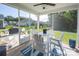Relaxing screened porch with white Adirondack chairs and a ceiling fan, perfect for outdoor living at 3619 Whitney Way, Terrell, NC 28682