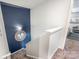 Stairway with a navy accent wall and decorative mirror, leading to the upper level at 3619 Whitney Way, Terrell, NC 28682