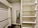 Organized walk-in closet with ample shelving, hanging rods, and a full-length mirror for convenience at 3619 Whitney Way, Terrell, NC 28682