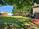 Expansive backyard featuring a lush lawn, mature trees, and a privacy fence perfect for outdoor activities and relaxation at 400 Antlers Ct, Gastonia, NC 28052