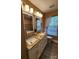 Bathroom features a double vanity with granite countertops and two large mirrors at 400 Antlers Ct, Gastonia, NC 28052