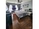 Spacious bedroom with dark hardwood floors and a ceiling fan at 400 Antlers Ct, Gastonia, NC 28052