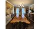 Elegant dining room with hardwood floors, decorative lighting, and large table, perfect for entertaining guests at 400 Antlers Ct, Gastonia, NC 28052