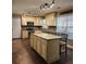 Spacious kitchen featuring stainless steel appliances, an island with seating, and ample counter space for cooking at 400 Antlers Ct, Gastonia, NC 28052