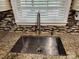 Close-up of the kitchen sink area, showcasing the stainless steel sink, granite countertops, and stylish faucet at 400 Antlers Ct, Gastonia, NC 28052