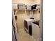 Functional laundry room featuring modern washer and dryer units and shelving for storage at 400 Antlers Ct, Gastonia, NC 28052
