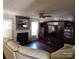 Cozy living room features a fireplace with decorative mirror and built in shelving with a large flatscreen TV at 400 Antlers Ct, Gastonia, NC 28052