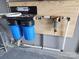 Close-up of the water filtration system, showcasing its dual-stage filtration process and compact design for clean water at 400 Antlers Ct, Gastonia, NC 28052