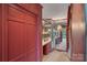 Bathroom vanity area with cabinets and mirrored walls that reflect a chandelier and an open room at 4749 16Th Street Ne Dr, Hickory, NC 28601