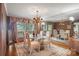 Sophisticated dining room with mirrored accent wall and window views at 4749 16Th Street Ne Dr, Hickory, NC 28601