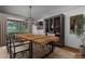Modern dining room featuring a unique chandelier and a long wooden table at 4749 16Th Street Ne Dr, Hickory, NC 28601